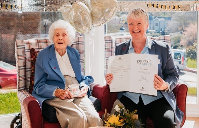 Joan Willett with her Point of Light Award and carer Pauline Glenet